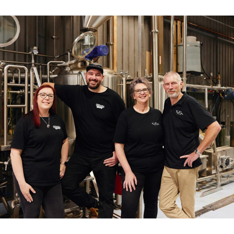 Distillery and Brewery owners standing in front of brewing rig. From left to right. Alison and Bradley Reid and Annette and Wayne Reid